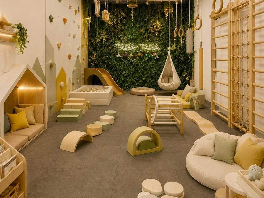 The movement room: climbing wall, rings, ladders and a green wall